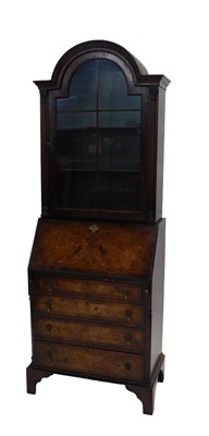 Lot 1056 - A walnut bureau bookcase, the associated...