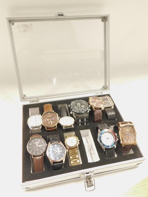 Lot 2209 - A watch case and contents of fashion watches,...
