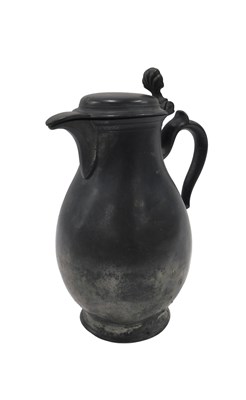 Lot 398 - A 18thC Belgian pewter flagon, of baluster...