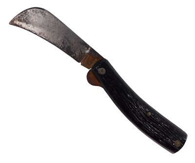 Lot 907 - A horn handled folding knife, with steel blade...