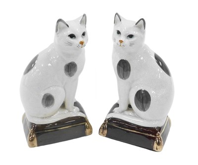 Lot 910 - A pair of Staffordshire style flat back cats,...