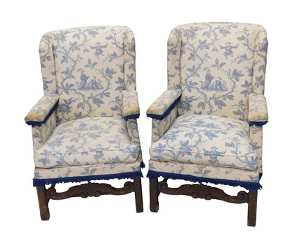 Lot 1032 - A pair of early 20thC wingback armchairs in...