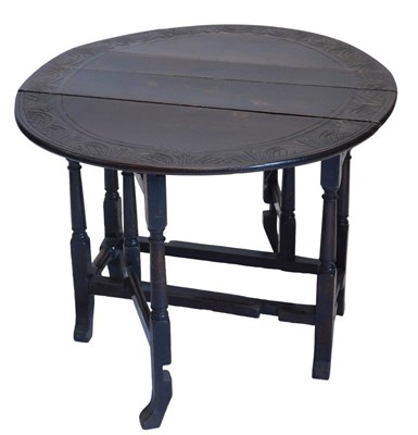 Lot 1039 - A late 17thC/early 18thC oak drop leaf table,...