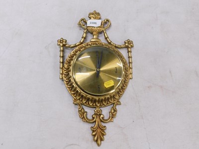 Lot 2286 - A gold painted wall clock, with urns and swags,...