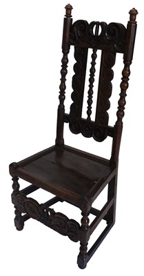 Lot 969 - An oak chair, the tall back carved with...