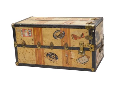 Lot 980 - A cream canvas and brass mounted wardrobe...