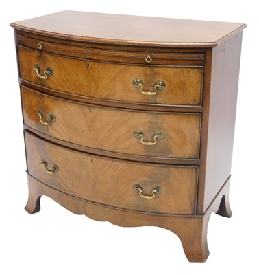Lot 983 - A mahogany bowfronted chest of drawers in...