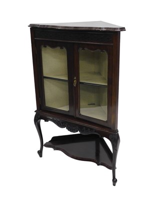 Lot 994 - An Edwardian mahogany standing corner cabinet,...