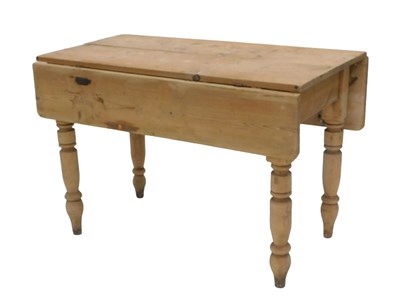 Lot 1069 - A Victorian stripped pine drop leaf kitchen...