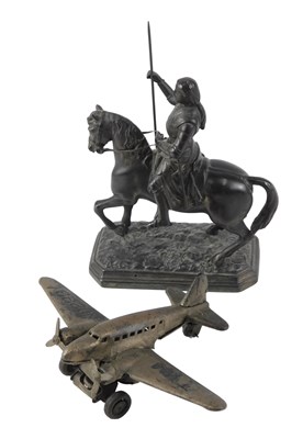 Lot 866a - A clockwork TWA aeroplane and spelter figure,...