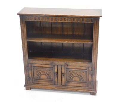 Lot 1046 - An oak bookcase, the rectangular top above a...