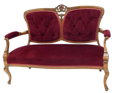 Lot 1001 - An Edwardian walnut salon sofa, the shaped...