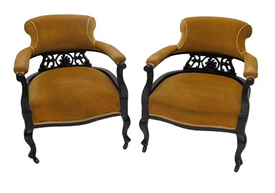 Lot 1005 - A pair of Edwardian mahogany tub shaped chairs,...