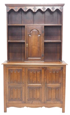 Lot 1050 - An oak dresser, the raised back with metal...