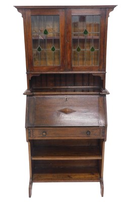 Lot 1055 - An early 20thC oak student's type bureau...