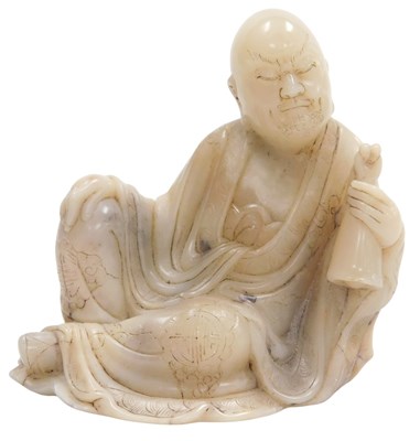 Lot 28 - A Chinese soapstone figure of Buddha, carved...