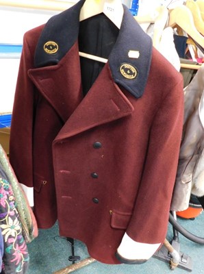 Lot 1721 - A maroon and black Drayman's coat, for The...