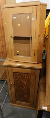 Lot 1548a - A pine cabinet, the panelled door enclosing...