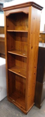 Lot 1556a - A pine narrow bookcase, with five shelves.