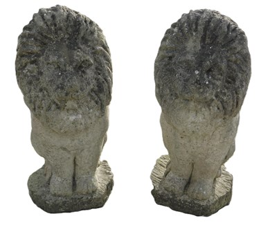 Lot 1092 - A pair of composition garden lions, 50cm high.