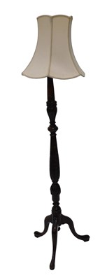 Lot 939 - A carved and turned beech standard lamp, on a...
