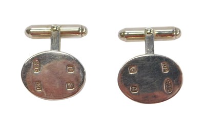 Lot 52 - A pair of silver cufflinks, each with oval...