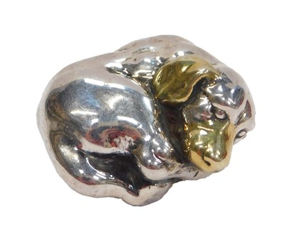 Lot 53 - A white metal brooch, in the form of a curled...