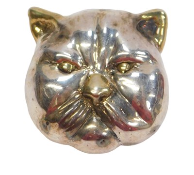 Lot 63 - A white metal brooch, formed as the face of a...