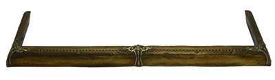 Lot 952 - An Edwardian brass fire curb, with scroll cast...