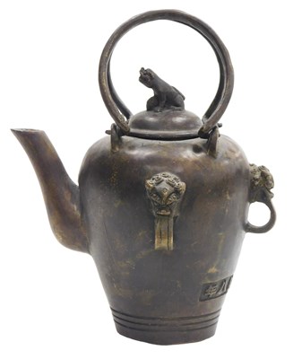 Lot 90 - A Chinese bronze teapot, with double up and...