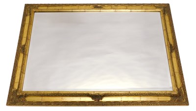 Lot 1016 - A gilt rectangular wall mirror, with a...