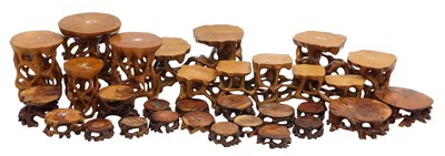 Lot 138 - A group of Oriental carved softwood stands, of...