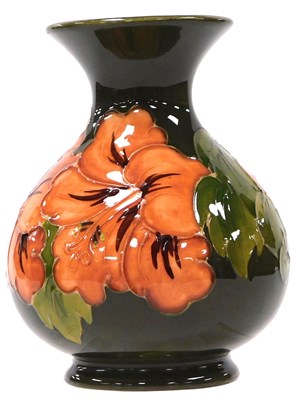 Lot 180 - A Moorcroft pottery Orange Hibiscus pattern...