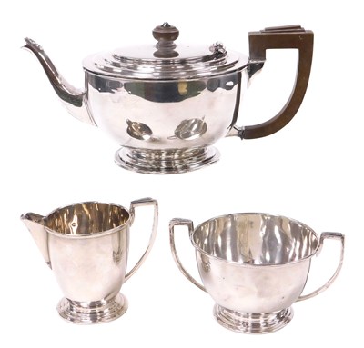 Lot 234 - A George V Art Deco silver three piece tea set,...