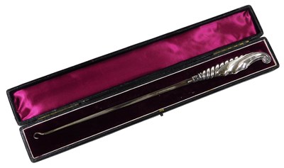 Lot 246 - A Victorian silver handled button hook, cased,...