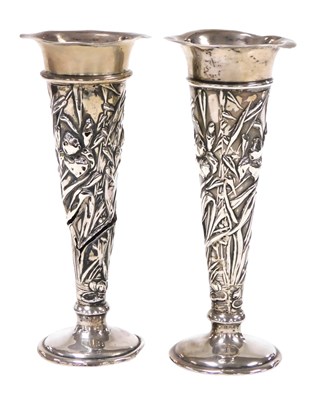 Lot 264 - A pair of Edward VII Art Nouveau loaded silver...