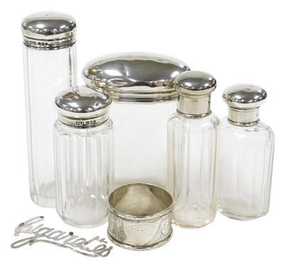 Lot 265 - Four George V silver lidded toilet jars,...