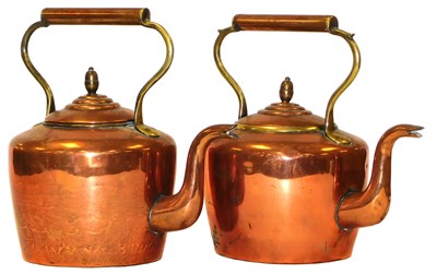Lot 286 - A pair of copper and brass kettles, the lids...