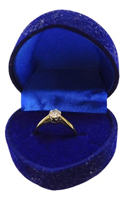Lot 310 - An 18ct gold and diamond solitaire ring, in a...