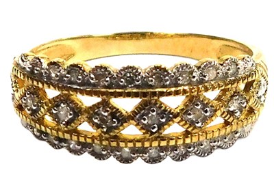 Lot 316 - A 9ct gold and diamond dress ring, in a three...