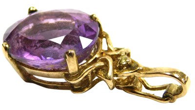 Lot 320 - An amethyst pendant, the oval cut amethyst, in...