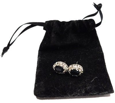 Lot 325 - A pair of sapphire and diamond earrings, the...