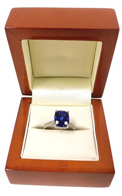 Lot 356 - A platinum and tanzanite ring, the cushion cut...