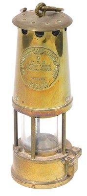 Lot 452 - A brass miner's safety lamp, by The Protector...