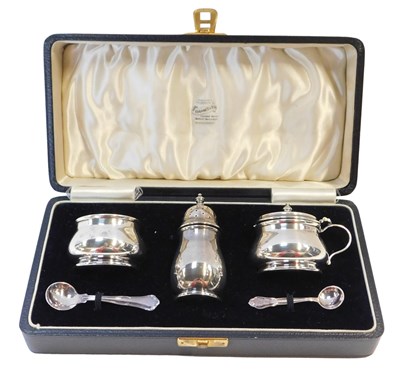 Lot 132 - A George VI silver three piece cruet set,...