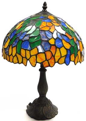 Lot 415 - A Tiffany style table lamp, with a domed shade,...