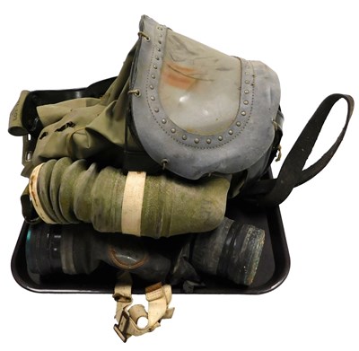 Lot 418 - A WWII British baby's gas mask, date '42, and...