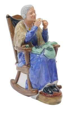 Lot 191 - A Royal Doulton figure modelled as A Stitch in...