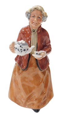 Lot 206 - A Royal Doulton figure modelled as Tea Time,...