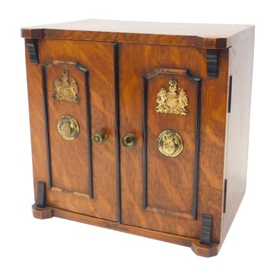 Lot 114 - A Victorian oak smoker's cabinet, modelled in...